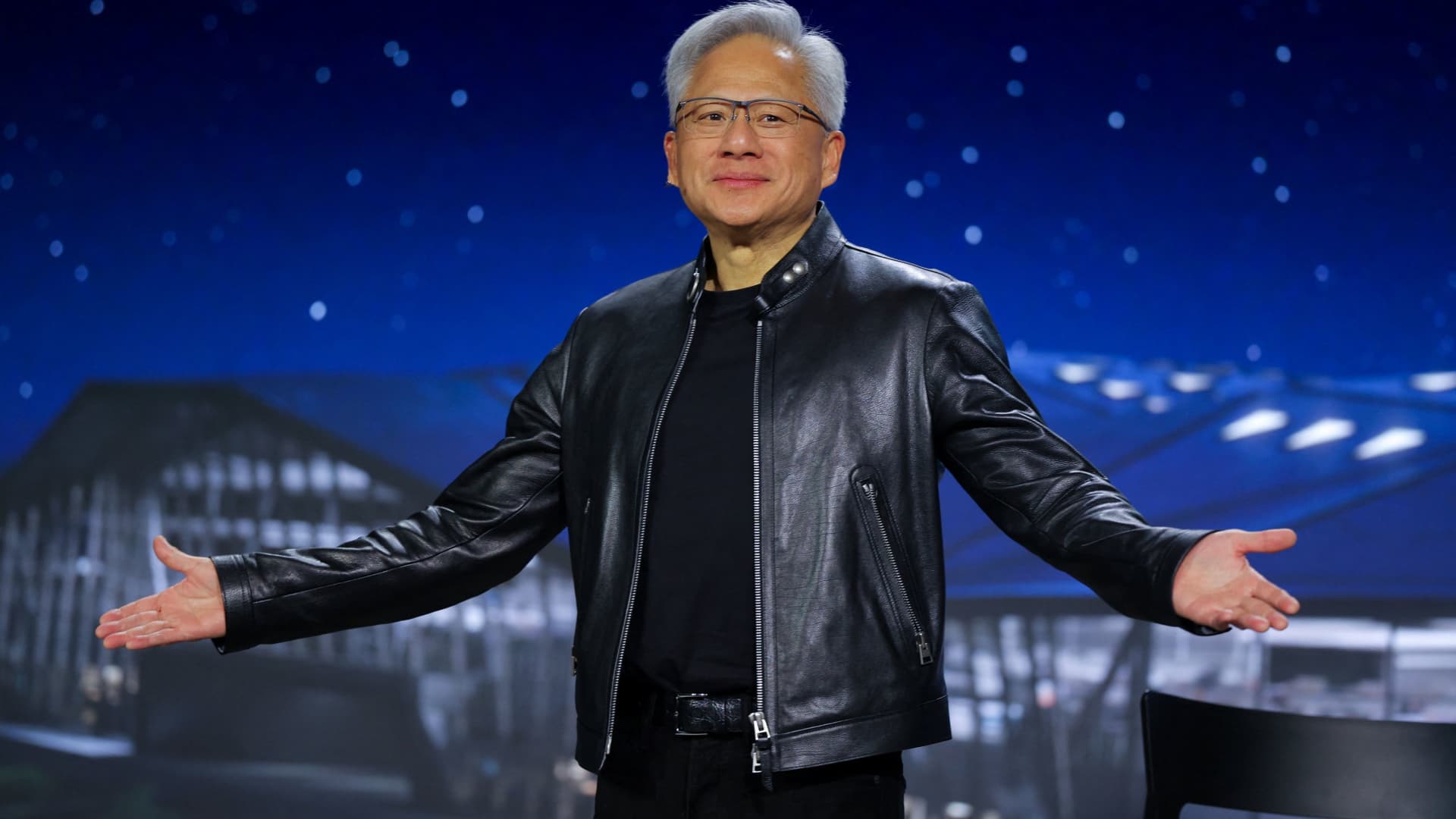 Nvidia shares hit a record, briefly pushing its market cap past $5 trillion